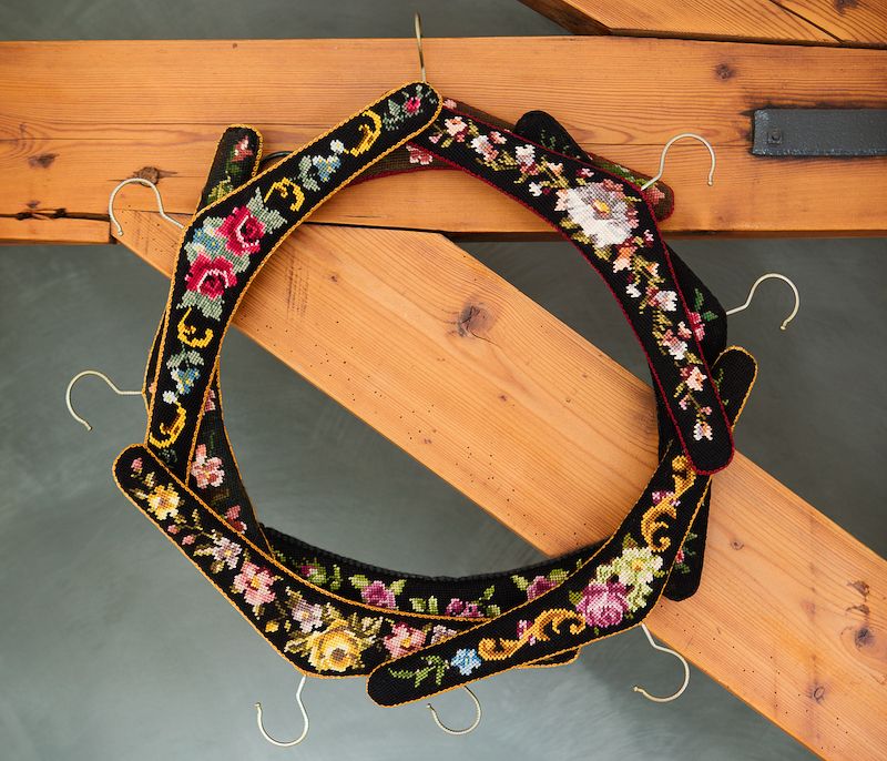 Vintage needlepoint hangers made into a DIY wreath.