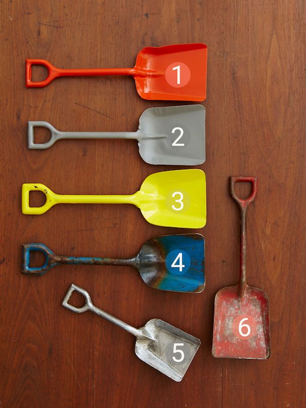 Toy metal shovels in different finishes and colors.