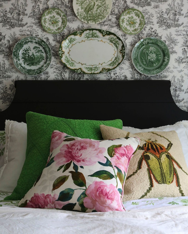 Floral textiles on vintage style bed.