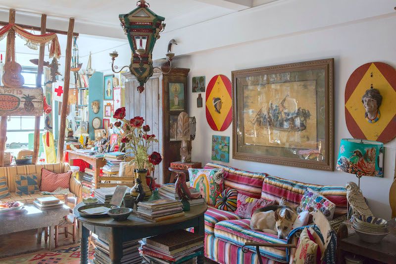 Quirky living space with eclectic vintage accessories and furniture in bright colors.