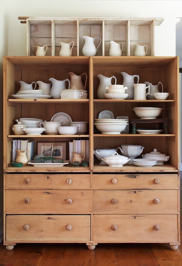 Vintage cabinet filled with 19th-century ironstone.